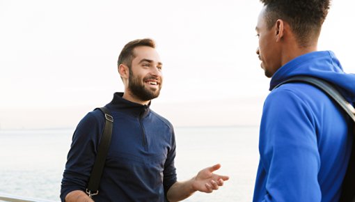 Photo of two men talking