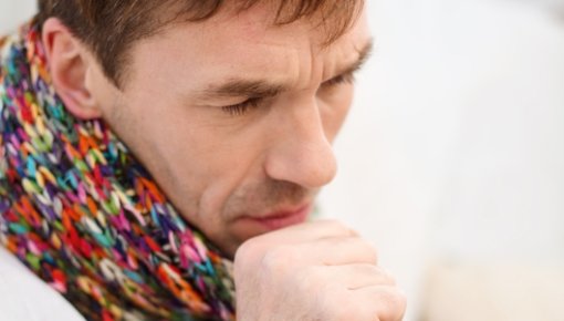 Photo of a man coughing