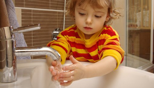Photo of a child washing their hands