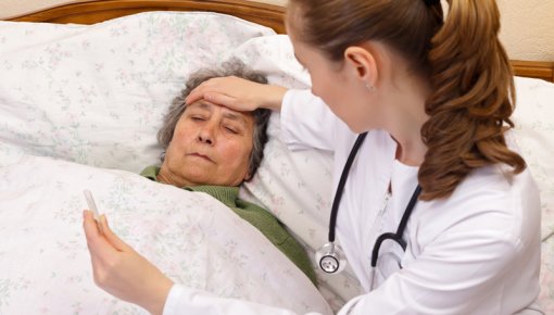 Photo of a patient and doctor during a home visit