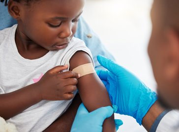 Photo of a girl being vaccinated