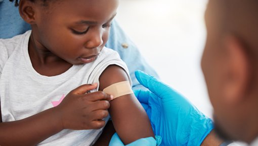 Photo of a girl being vaccinated