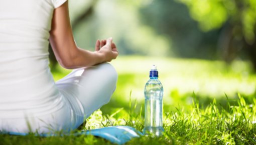 Photo of a woman doing yoga outdoors