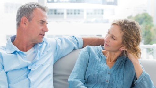 Photo of a man and a woman talking