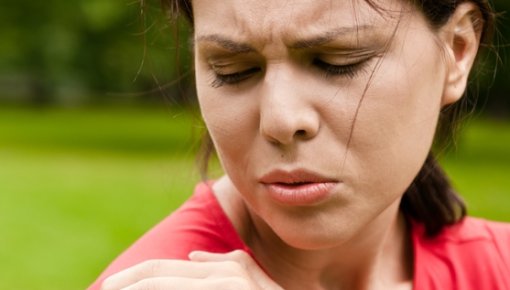 Photo of a woman with neck pain