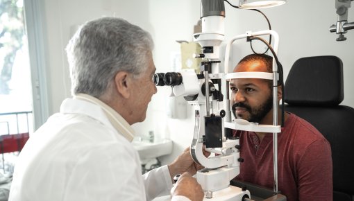 Photo of a patient and a doctor during an eye examination