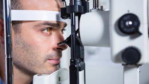 Photo of a patient having his eyes examined