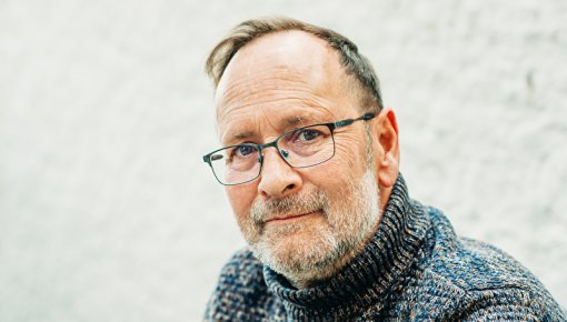 Photo of a man wearing glasses