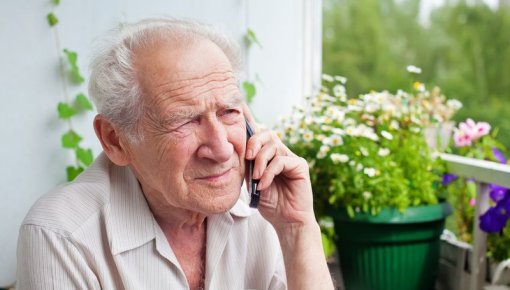 Photo of older man on the phone