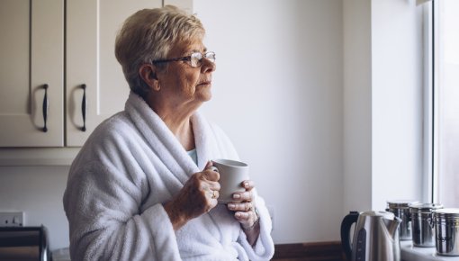 Photo of an elderly woman lost in thought