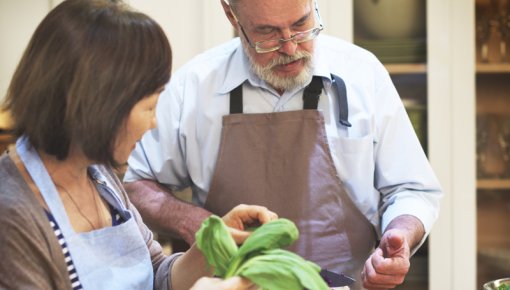 Photo of a couple preparing a meal