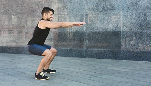 Photo of a man doing stretching and strengthening exercises