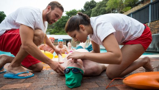 Photo of two lifeguards saving a man