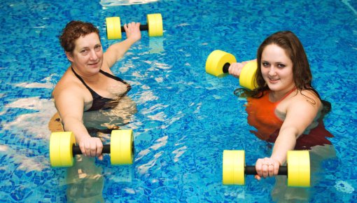 Photo of two women swimming