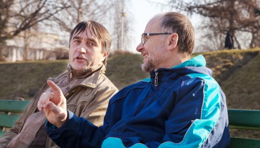 Photo of two men chatting