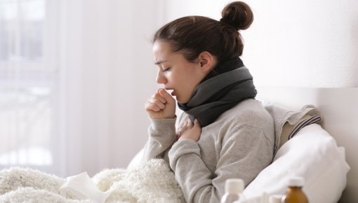 Photo of a woman with common cold symptoms