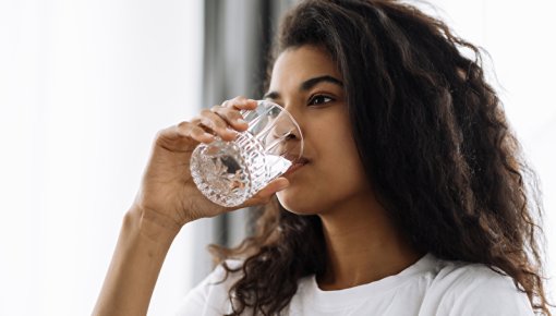 Photo of woman taking medication