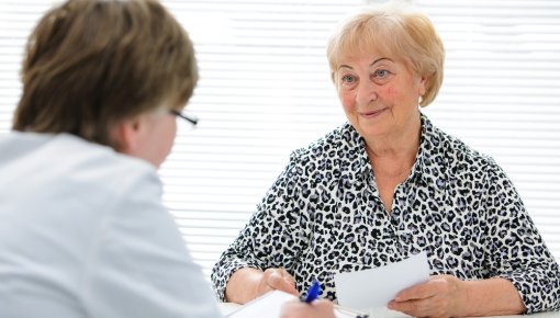 Photo of a patient talking with her doctor