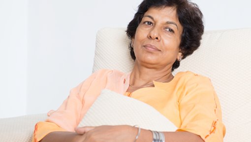 Woman resting in an armchair