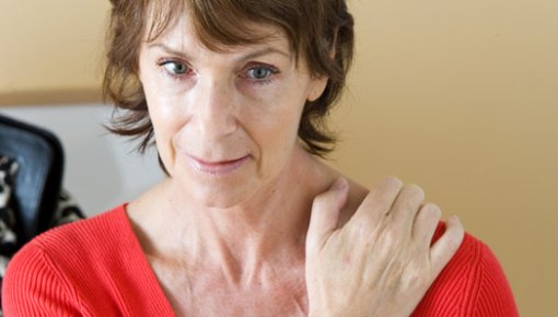 Photo of a woman with shoulder pain