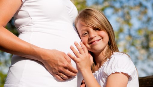 Photo of a pregnant mother and her daughter