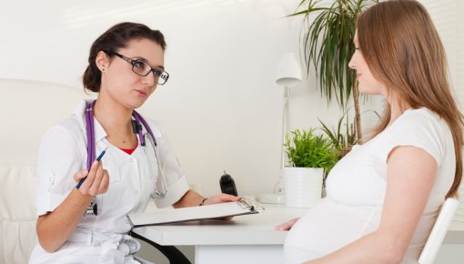 Photo of a gynecologist with a pregnant woman