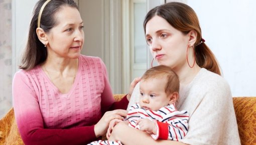 Photo of young woman with depression after childbirth