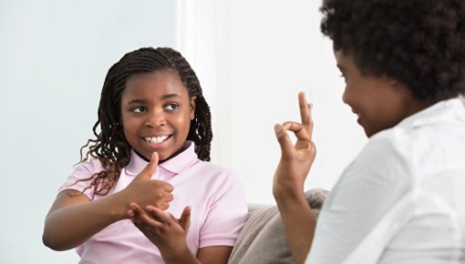 Photo of a girl doing sign language