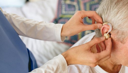 Photo of man with a hearing aid