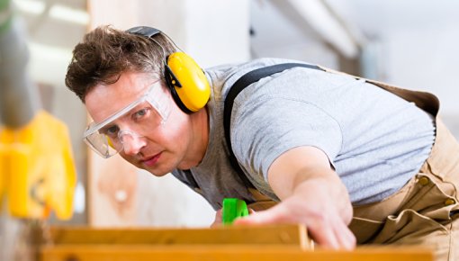 Photo of a carpenter with ear protection