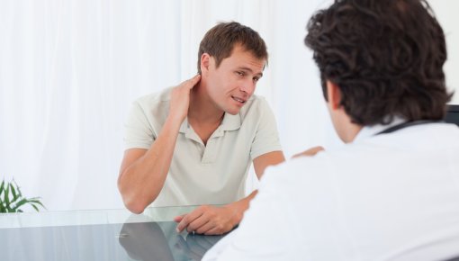 Photo of a man talking to a doctor