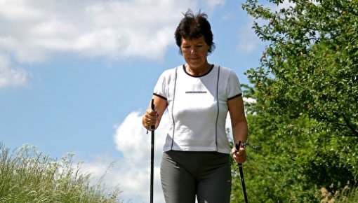 Photo of a woman Nordic walking