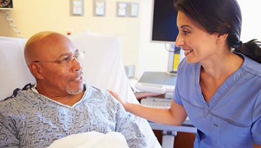 Photo of a nurse and patient in hospital
