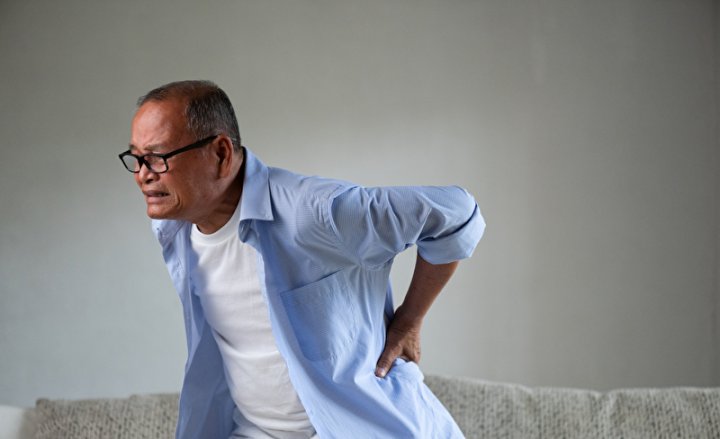 Photo of a man with back pain