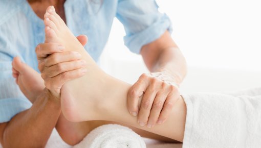 Photo of a physical therapist treating a foot
