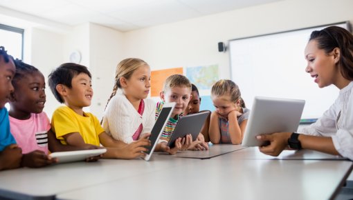 Photo of a school teacher giving a lesson