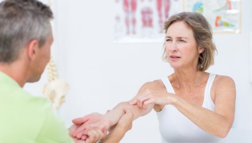 Photo of a female patient and a physical therapist