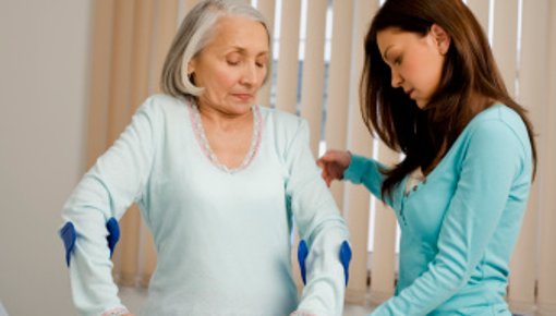 Photo of a woman in the hospital with crutches