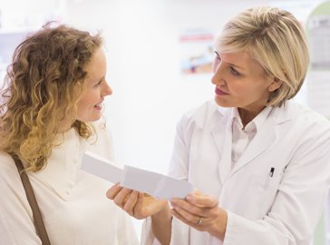 Photo of a patient talking with her doctor