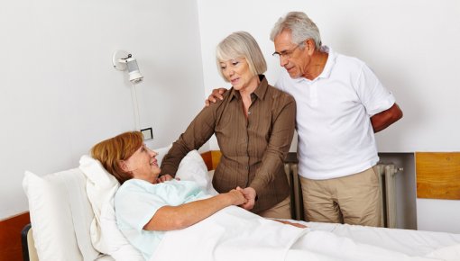 Photo of a patient and visitors at the hospital