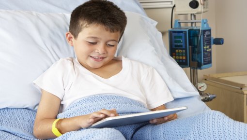 Photo of little boy in a hospital bed