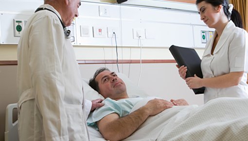 Photo of patient and medical staff in a hospital