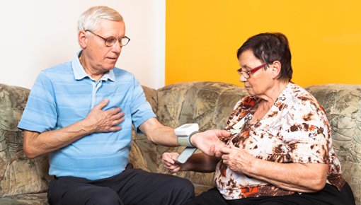 Photo of a couple measuring blood pressure