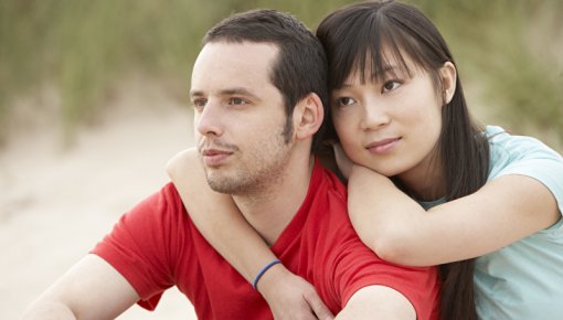 Photo of a couple sitting outdoors