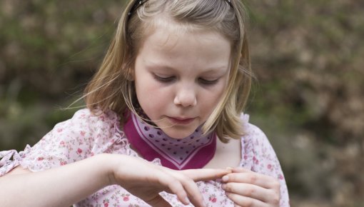 Photo of girl looking at her finger