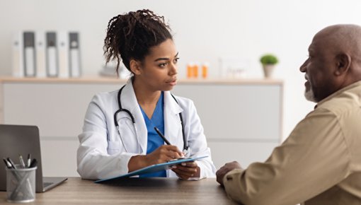 Photo of patient and doctor in conversation