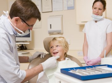 Photo of a young boy at a visit to the dentist