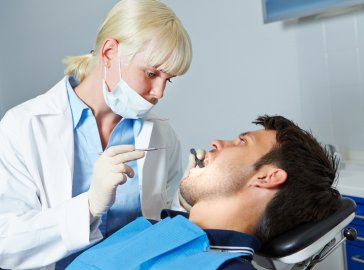 Photo of a man at the dentist