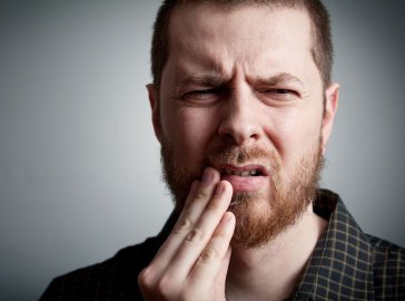 Photo of a man with toothache