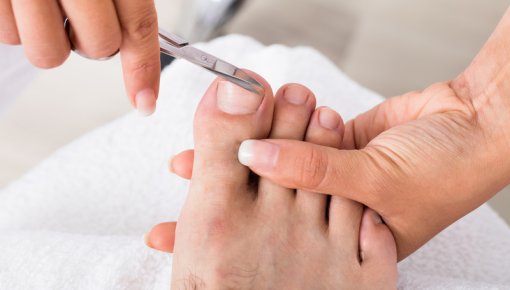Photo of toenails being cut